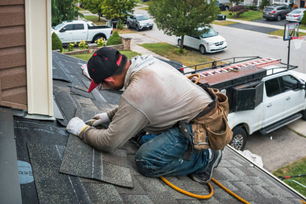 Professional Roofing technician working in South Kent, CT